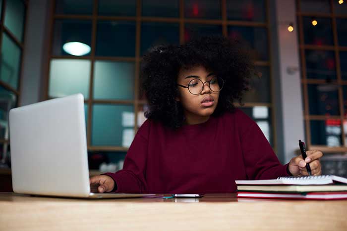 Young woman focused on her work at a computer